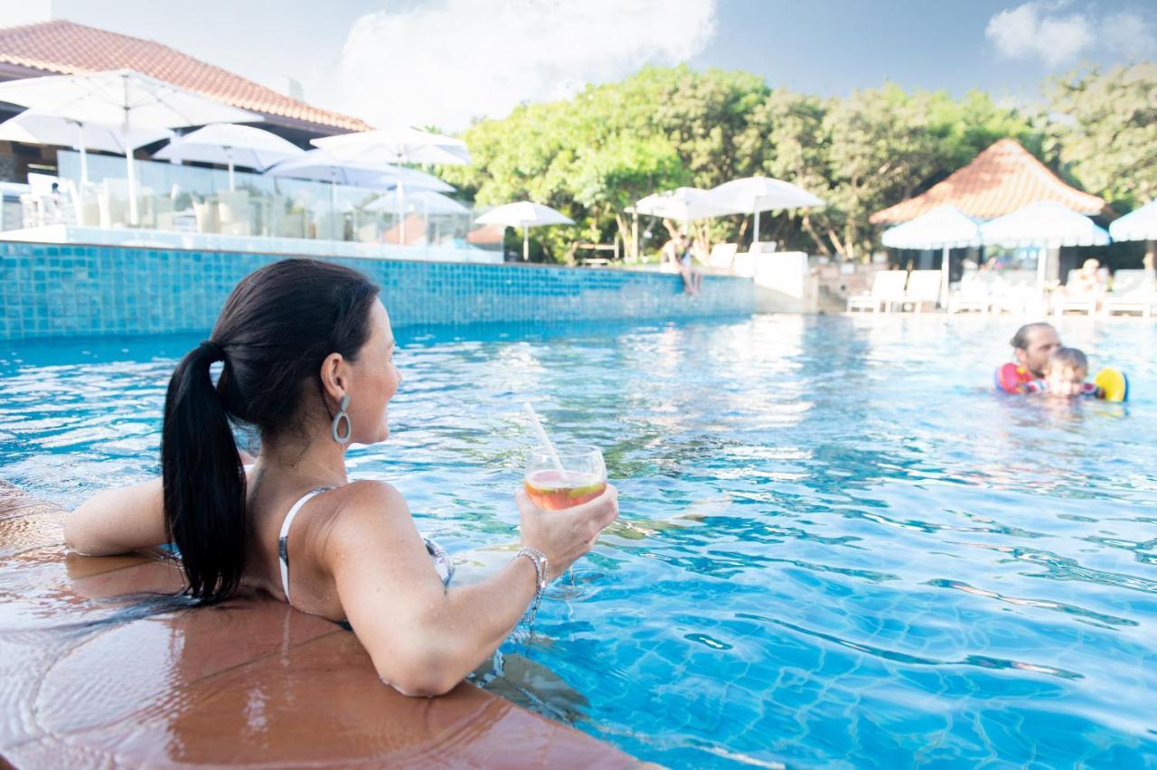 Hotel The Capital Zimbali Ballito Exteriér fotografie A woman relaxing at a pool
